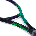 Yonex VCORE Pro 97D tennis racquet resting on a tennis court, ready for competition-level play.