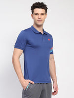 Man wearing a blue athletic polo shirt with a logo on a white background