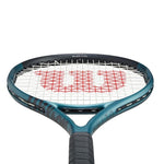 The Wilson Ultra Team V4 tennis racet shining in sunlight, showing off its eye-catching color-shifting blue finish. Get the best Wilson tennis racket price in India at ProBadminton.in.