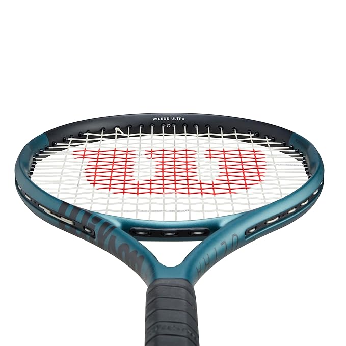 The Wilson Ultra Team V4 tennis racet shining in sunlight, showing off its eye-catching color-shifting blue finish. Get the best Wilson tennis racket price in India at ProBadminton.in.