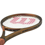 Alt Text: Intermediate player easily maneuvering the Wilson Pro Staff Team V14 tenniss racquet (280g Strung) from the baseline. Shop now at ProBadminton.in.