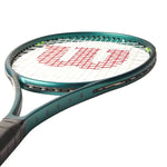 Seasoned athlete holding the Wilson Blade 98 V9 tenniss racquet, demonstrating its pinpoint accuracy and strong returns. Available now on ProBadminton.in.