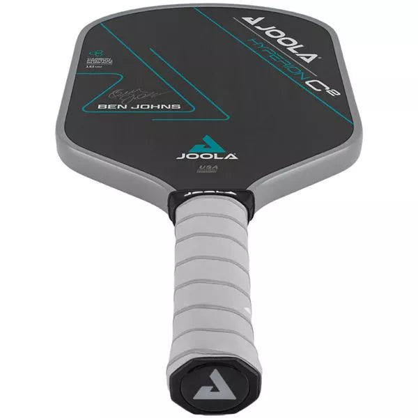 Close-up of Gray Feel-Tec Pure Grip: "Detailed shot of the Gray Feel-Tec Pure grip on the Joola Ben Johns Hyperion C2 CFS 16 Paddle, emphasizing its texture and comfort."