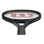 Alt Text: Close-up of the Wilson Pro Staff 97L V13 290g teniss racket's frame, showcasing the double braided fibers at 45-degree angles for superb ball pocketing