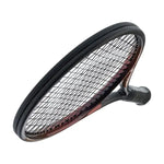 Head Prestige MP Racquet on court: "Head Prestige MP Tennis Racquet resting on a tennis court, ready for action."

