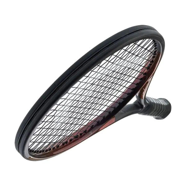 Head Prestige MP Racquet on court: "Head Prestige MP Tennis Racquet resting on a tennis court, ready for action."

